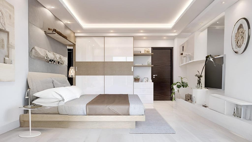 Sliding wardrobe in a small bedroom with decluttered surfaces